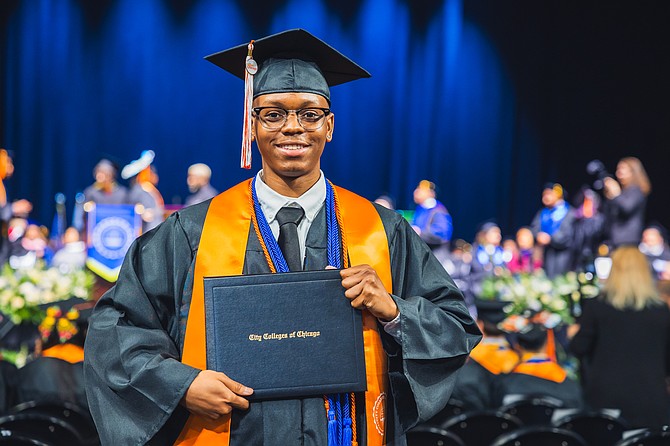 Proud of his accomplishments Jajuan Folks, a former graduate of Al Raby High School shows off his diploma. PHOTO COURTESY OF HOPE CHICAGO