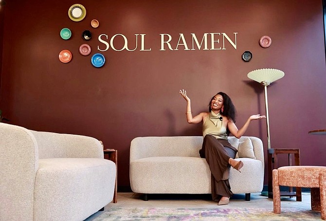 Airian McDuffy, owner of Soul Ramen Chicago enjoys a moment of smiles ahead of welcoming guests into the newly opened Soul Ramen Restaurant. The Black women owned Ramen Bar is located at 508 East Pershing Road, in Chicago’s Historic Bronzeville community. Photo credit: Joseph Ignatius of E11evate Photography