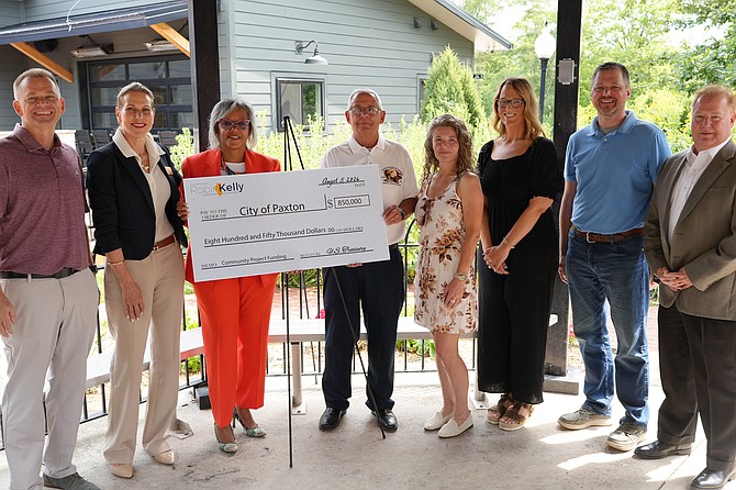 Congresswoman Robin Kelly hands off Ceremonial Check to the City of Paxton and Stakeholders.  Photo courtesy of Kelly’s Congressional Office.