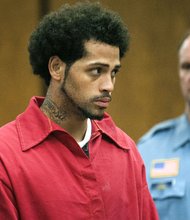 A man arrested in Connecticut in connection with the murder case against former New England Patriots tight end Aaron Hernandez is on his way to Massachusetts. A judge in Bristol, Conn., ordered Carlos Ortiz turned over to Massachusetts authorities during a hearing Friday morning. Ortiz has been charged in Connecticut as a fugitive from justice. He had waived extradition to Massachusetts and was being held on $1.5 million bail in Hartford. New Britain State's attorney says investigators arrested the 27-year-old Ortiz in Bristol on Wednesday as part of the probe into the slaying of Odin Lloyd. Hernandez is charged with murder in the slaying of Lloyd near Hernandez's North Attleborough home. Hernandez has pleaded not guilty and is being held without bail.