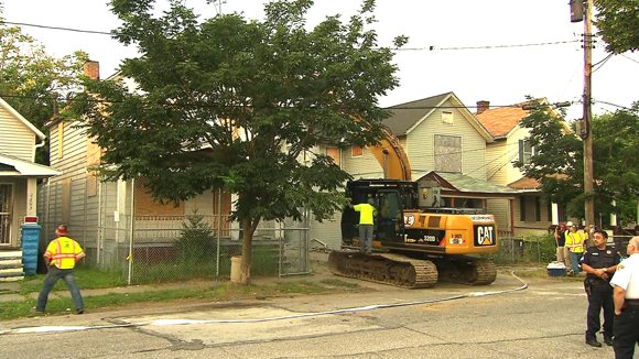 Workers began tearing down Ariel Castro's house of horrors where he held three women captive for years on Wednesday, August 7, 2013. Castro forfeited the house on Seymour Avenue as part of a plea deal with prosecutors that took the death penalty off the table in exchange for a life sentence, plus 1,000 years in prison.