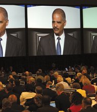 U.S. Attorney General Eric Holder speaks at the annual meeting of the American Bar Association's House of Delegates on Monday, August 12, 2013.