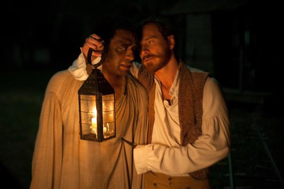 Chiwetel Ejiofor as "Solomon Northup" and Michael Fassbender as "Edwin Epps" in Steve McQueens's “12 Years A Slave."
