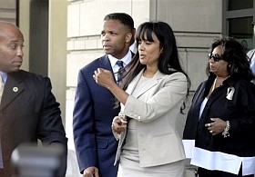 Former U.S. Congressman Jesse Jackson Jr., and his wife Sandra, leaves federal court in Washington, Wednesday, Aug. 14, 2013. Jackson was sentenced to two and a half years in prison Wednesday. His wife received a sentence of one year. (AP)