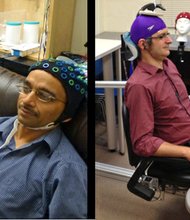 Researchers at the University of Washington have demonstrated what they say is the first example of a noninvasive human-to-human brain interface. In a video posted online, they show how a scientist could control another scientist's hand motions just by using brain signals sent over the Internet. Rajesh Rao, left, send brain signals to Andrea Stocco, right, in a different laboratory.