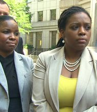 A federal jury in New York ruled Tuesday, September 3, 2013, that a Hispanic American man and the nonprofit he founded must pay punitive damages to an African American employee after a previous ruling that the use of the "n-word" is inappropriate among minorities in a workplace. Brandi Johnson was (light blue jacket) was awarded $280,000 in damages.