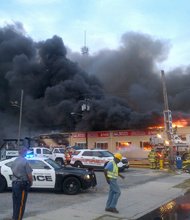 Fire tears through the iconic Seaside, New Jersey boardwalk on September 12, 2013.