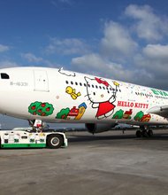 Last week, Taiwan-based EVA Air launched its first long-range jet — flying between Taipei and Los Angeles — emblazoned with everyone's favorite mouthless cat. Not just the fuselage, but everything on the EVA's feline flying machines is Kitty themed, from crew members' uniforms to the coffee cups, head rests, toilet rolls and food.