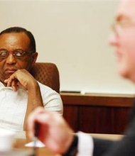In this Saturday, Aug. 31, 2013, file photo, Jimmy Simmons, left, president of the NAACP's Casper branch, listens to John Abarr, a kleagle of the United Klans of America, out of Great Falls, Mont., during a meeting at the Parkway Plaza hotel in Casper, Wyo. Simmons spent several months attempting to organize the meeting due to concerns about reports of violence against black men and Ku Klux Klan pamphleting in Gillette, Wyo. The gathering, which took place in private under heavy security, was the first formal meeting between Klan and NAACP representatives that either side was aware of.
(AP Photo/Casper Star-Tribune, Alan Rogers, File)