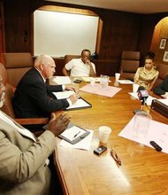 In this Saturday, Aug. 31, 2013, file photo, leaders of the NAACP's Casper branch speak with John Abarr, far right, a kleagle of the United Klans of America, out of Great Falls, Mont., at the Parkway Plaza hotel in Casper, Wyo. Jimmy Simmons, president of the NAACP Casper branch, spent several months attempting to organize the meeting due to concerns about reports of violence against black men and Ku Klux Klan pamphleting in Gillette, Wyo. The gathering, which took place in private under heavy security, was the first formal meeting between Klan and NAACP representatives that either side was aware of. (AP Photo/Casper Star-Tribune, Alan Rogers, File)