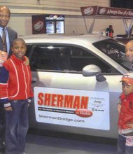 L-R Ron Collins, Business Manager of Sherman Dodge, Neimah Johnson, Dodge Challenger, Brian Johnson, Jeremiah Jr., Jeremiah Johnson, Sr.