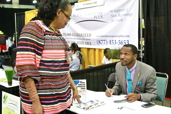 Mary Johnson gets valuable information about college best from exhibitor Kevin Brown.