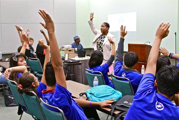 Jr. Business Camp participants respond to one of their speakers.