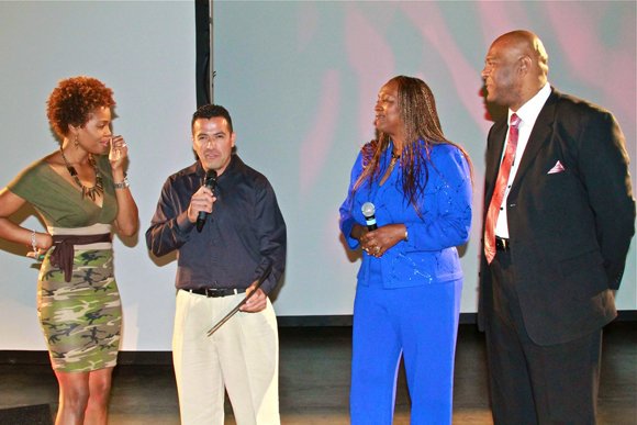 Coach Mai Brooks, far left, and West Coast Expo organizers, far right, Natalie Cole and David Miller, congratulate participants in the Weight-A-Minute weight loss competition.