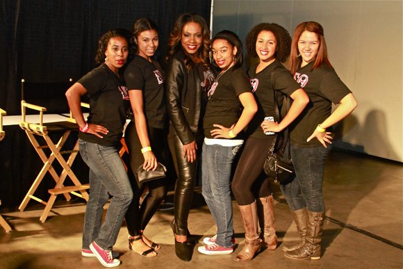 West Coast Expo celebrity host Sheryl Lee Ralph, center, stops a moment to visit Delta Sigma Theta sorority steppers.