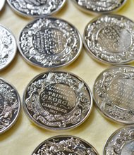 The only official UK coins being struck to commemorate the christening of HRH Prince George of Cambridge are going into production on Tuesday 8 October at The Royal Mint in Llantrisant, South Wales.