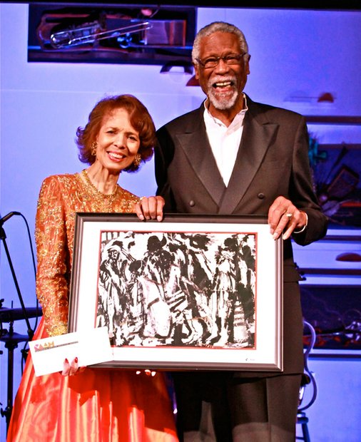 NBA Hall of Fame player, coach and announcer, Bill Russell (right), presents a Lifetime Achievement Award to collage artist and “artpreneur,” Phoebe Beasley at CAAM’s annual gala.