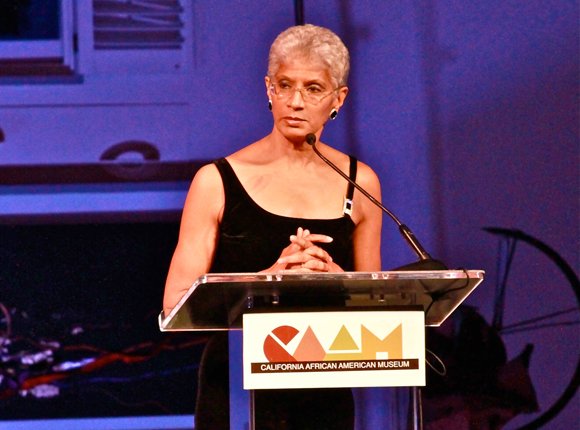 Charmaine Jefferson, executive director of the California African American Museum greets the audience at the museum’s annual Gala, “An Artful Evening at CAAM,” held Saturday.