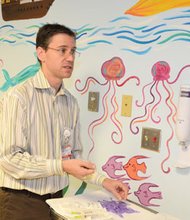 Dr. Marc Futernick, medical director of emergency medicine at California Hospital Medical Center (CHMC), shows off the “kid-friendly” emergency room bay. The wall of the downtown hospital ER bay was painted by a local artist to help make pediatric patients more comfortable during their visit. This is just one of the many quality and safety measures for treating children implemented by CHMC that helped the facility earn the hospital the prestigious Kid-Qualified designation from Valley Emergency Physicians Medical Group Inc. This is the physician practice group providing emergency services to the medical center and to more than 35 hospitals in California and around the country. CHMC treats more than 12,000 children every year, and according to Dr. Futernick, “three of the most common issues in providing emergency care to children nationwide are delays in diagnosis, inconsistency in the care provided and improper medication doses,” he added. “This accomplishment conveys our team’s focus on being both high-tech and high-touch, providing rapid diagnosis, consistent care, and appropriate medication doses to our youngest patients.”