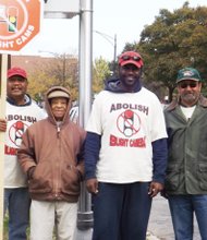 WVON Radio Talk Show host, Mark Wallace, pictured center, stands with members of a group he founded called the Citizens to Abolish Red-light Cameras during a red-light enforcement and speed camera protest at 53rd Street and Cottage Grove last month..
