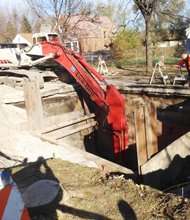 The  City's infrastructure might have played a significant role in the "wash out" (a sudden erosion of soft soil or other support surfaces by a gush of water) at 124th and Wentworth Ave. which caused the road to collapse creating a large sink hole, because most of its underground pipes and water systems are at or over 100 years old. 
