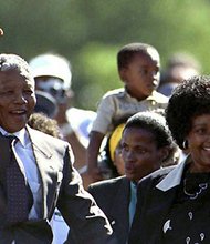 Nelson Mandela is accompanied by his wife Winnie, moments after his release from Victor Verster prison. 