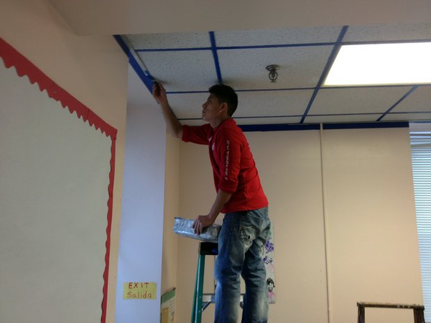 Ivan Barrera, of Joliet, paints one of the rooms at the Spanish Community Center in Joliet.