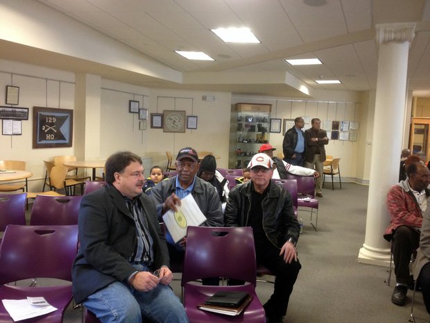 Jeff Plyman, Joliet's city attorney, talks with some residents before the informational session held March 15 at the Joliet Historical Museum.