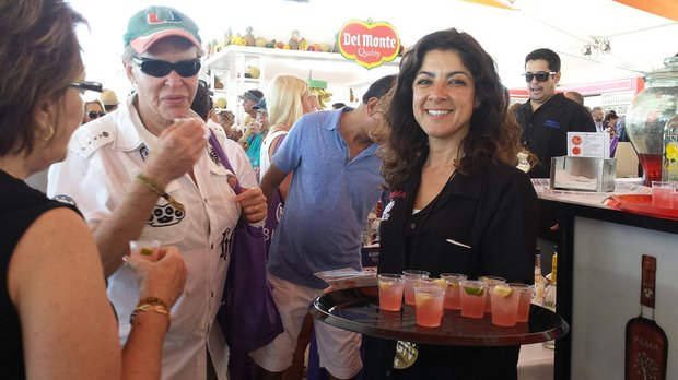 A waitress serves up some fruity cocktails to guests at the event.