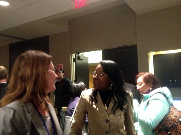 Joliet City Clerk Christa Desiderio (left) chats with new 4th District City Councilwoman Bettye Gavin after Tuesday's council meeting.