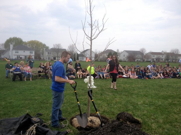Jim Tieber, arborist for Joliet, gets the shovels ready for the students to help plant the tree.