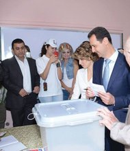 Bashar al Assad and his wife voting in Damascus 6/3/14.