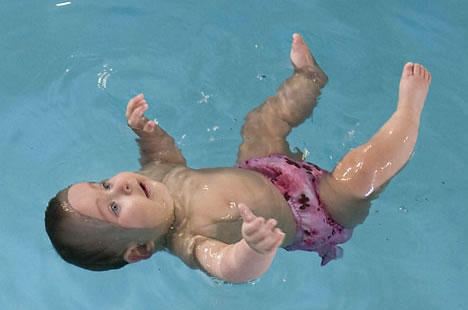 baby floating in water