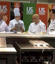 Joliet Junior College student Kristyn Chatlosh confers with judges, who gave her the third highest score in a recent culinary youth Olympics finals competition -- enough to land her a spot on Team USA 2016.