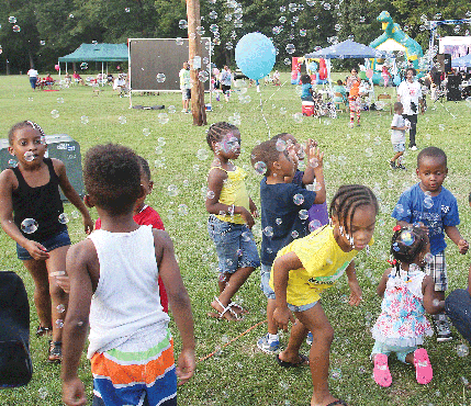 Children have a bubblicious time at a National Night Out event at J.L. Francis Elementary School on South Side. 
