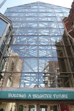 This optimistic slogan just seems like a bad joke. It’s attached to the front of this long-vacant glass palace in Downtown. 
The “Building A Brighter Future” slogan sits above the entry to the one-time food court and restaurant space of the long-gone 6th Street Marketplace, a failed Downtown shopping mall, most of which was torn down.
This section, which survived, has been closed for at least seven years, with no indication city officials are actively marketing the space. For several years, private developers offered proposals to transform the building into apartments, but the city showed little interest and nothing came of the ideas.
So, for now, the brighter future remains on hold. 