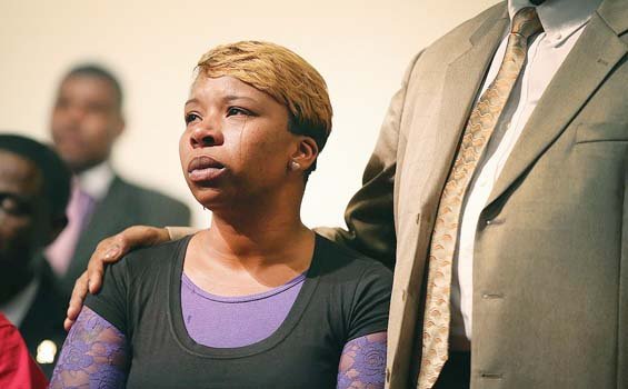 Lesley McSpadden weeps over the police killing of her son, Michael Brown Jr., in Ferguson, Mo. His death has sparked protests and riots in the community outside St. Louis.