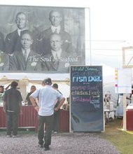 Only a few fans line up for food at Croaker's Spot and Big Herm's at Training Camp.