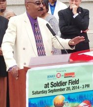 Everett Rand co-founder of the Chicago Football Classic, speaks on Monday during a press conference (with supporter Father Michael Pfleger in background) about the upcoming traditional game to be played between Central State University, hailing from in Wilberforce, Ohio and Morehouse College of Atlanta, Ga., on Saturday, September 20 at Soldier Field football stadium.  Kick-off time is 3:00 pm.