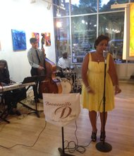 Senabella and Bobby Irving perform at Gallery Guichard, 432 E. 47th St, during the second annual Bronzeville Nights, a series of events designed to support local businesses in Chicago's Bronzeville community. 