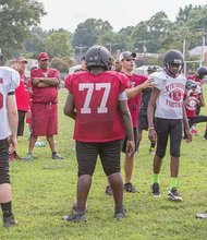Thomas Jefferson coach Chad Hornik, center in sunglasses, prepares the Vikings for the upcoming season.  The team will travel Aug. 29 to Colonial Heights for its first game.