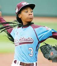 Strikeout phenom Mo’Ne Davis fires a pitch for Philadelphia in her historic 4-0 win over Tennessee.