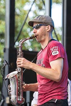 Saxophonist Katisse Buckingham serves up saxophone sounds with Down to the Bone. 