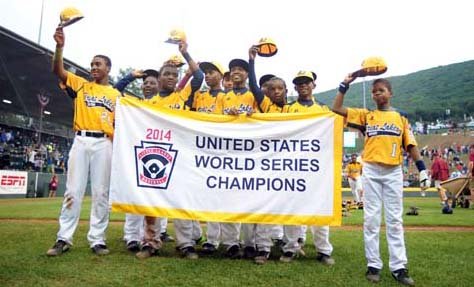Smiling players from Jackie Robinson West tip their caps to cheering fans as Little League’s U.S. champions. The team from Chicago claimed the title with a 7-5 win over Las Vegas. 