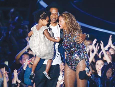 Beyoncé receives congratulations from daughter Blue Ivy and husband Jay Z after he presented her with the Michael Jackson Video Vanguard Award. The award, begun in 1984, recognizes performers who have had a profound effect on MTV culture and music videos.  