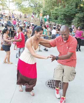 Vanessa Galvez and Alex Adams display some fancy footwork during the Latin Jazz and Salsa Festival at Dogwood Dell in Byrd Park