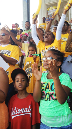 Young fans of the Jackie Robinson West All-Stars display a wide range of emotions as the team was announced on the loud speaker during a citywide celebration for the team at Millennium Park in downtown Chicago on August 27th, 2014.