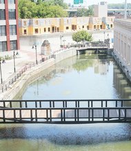 This view toward the east shows the new bridge that now spans the Canal Walk in Downtown. The metal bridge was installed earlier this month near South 12th Street. The bridge is 87 feet long and 10 feet wide, making it ideal for pedestrians and bicyclists. The bridge is part of $1.7 million in improvements the city is investing in the area.