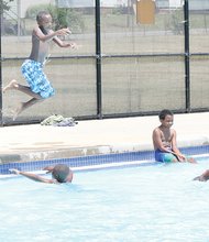 Children enjoy a splash in the city's Fairmount Pool in the East End. They're starting to take their final dips as the city will close all of its outdoor pools when schools reopen Tuesday.