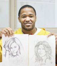 Sherod Jones displays sketches he has drawn to express himself at the Richmond Justice Center.